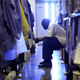 An inmate at the Mule Creek State Prison sits on his bunk bed in a gymnasium that was modified to house prisoners in Ione, Calif., on Aug. 28, 2007. (Justin Sullivan/Getty Images)